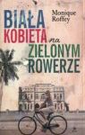 BIAŁA KOBIETA NA ZIELONYM ROWERZE